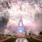 Eiffel Tower lit up by fireworks for Bastille Day - video